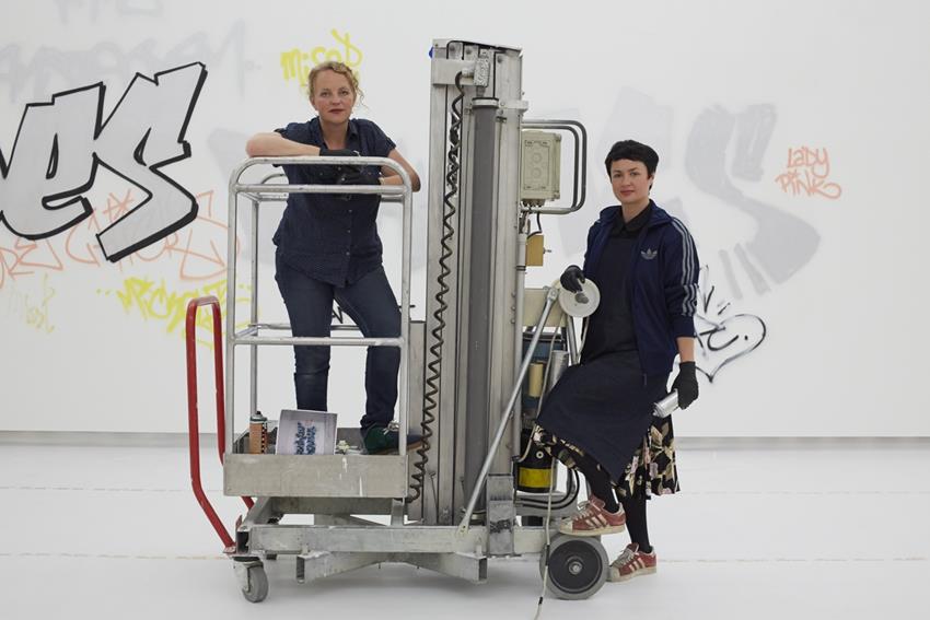 Mick la Rock (l) and Paulina Olowska at work at the exhibition Au Bonheur Des Dames